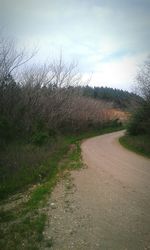 Road amidst landscape against sky