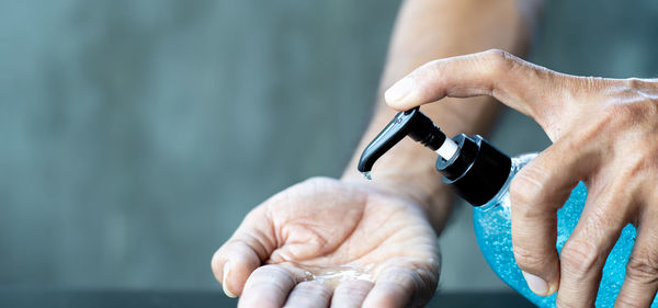 Close-up of man holding hands