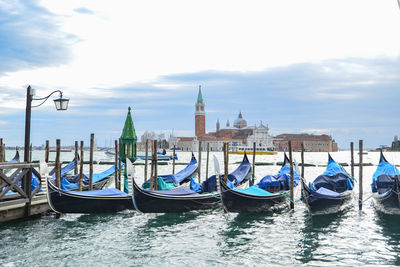 Boats moored in canal