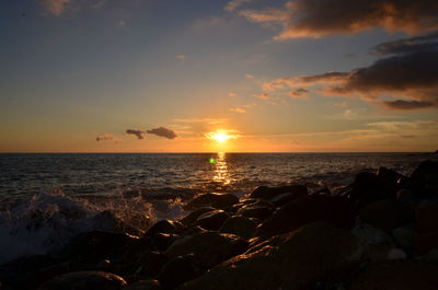 Scenic view of sea against sky during sunset