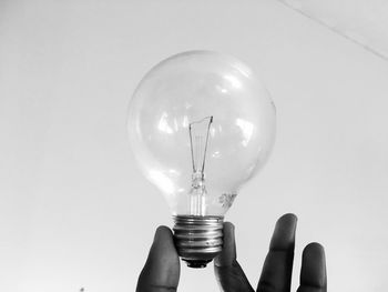 Holding lightbulb