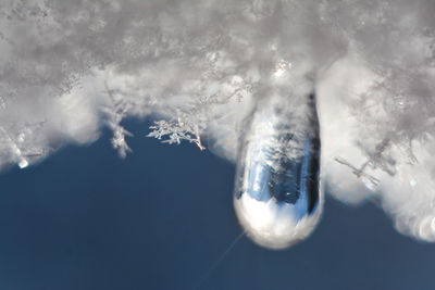 Close-up of snow on water