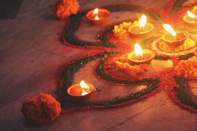 High angle view of lit candles