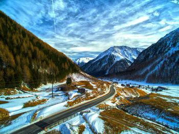 High angle view of empty road in snowy valley