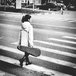 Woman standing on city street