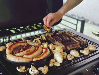 Cropped image of man preparing food