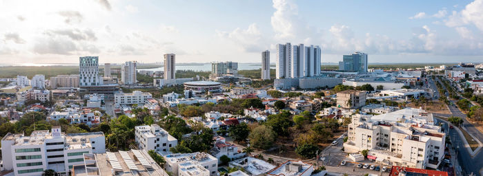 Busy street with small buildings near the beach area of cancun