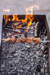 Close-up of firewood on barbecue grill