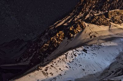 High angle view of snowcapped mountain at night