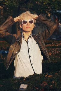 Young woman wearing sunglasses standing outdoors