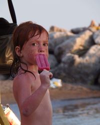 Portrait of girl eating ice lolly