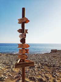 Lifeguard hut on beach against clear sky