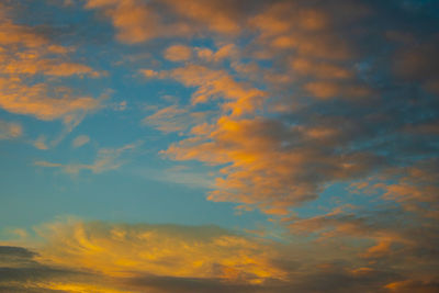 Low angle view of dramatic sky during sunset