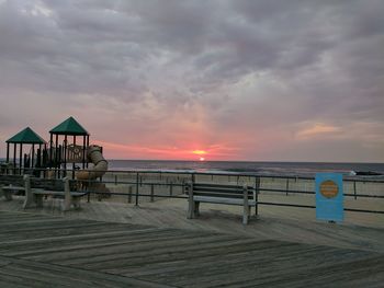 Scenic view of beach against sky during sunset