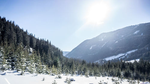 Scenic view of snow covered mountains against sky