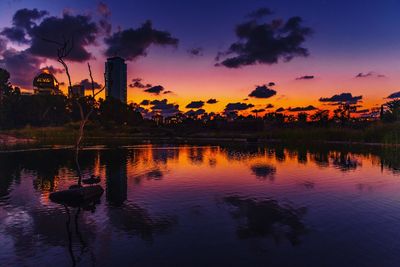 Scenic view of lake against orange sky