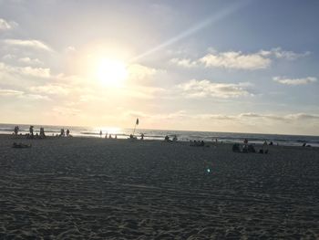 Scenic view of beach against sky during sunset