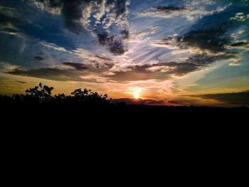 Scenic view of silhouette landscape against sky during sunset