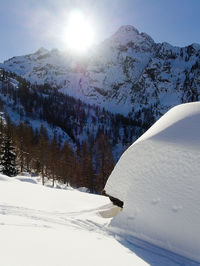 Snow covered mountain against sky