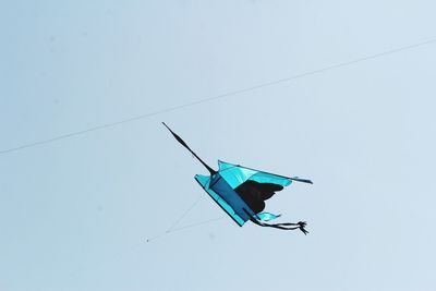 Low angle view of kite flying against clear sky