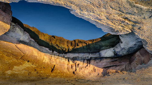 Scenic view of rock formations against sky at night