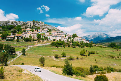 Low angle view of buildings in town against sky