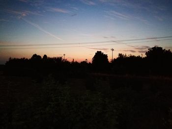 Scenic view of silhouette landscape against sky at sunset