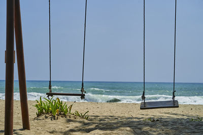 Scenic view of beach against clear sky