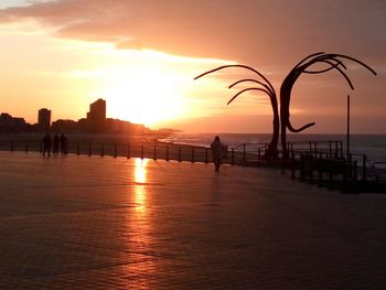 Silhouette of people at sunset