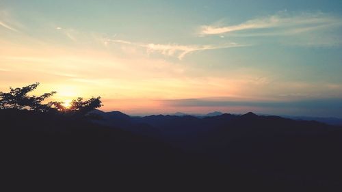 Silhouette of landscape against sky during sunset