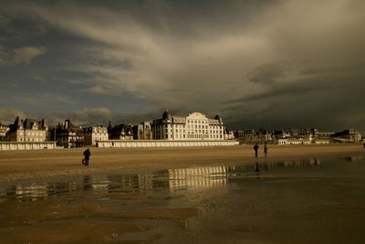 View of buildings against cloudy sky