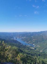 High angle view of landscape against blue sky