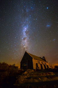 Low angle view of building against sky at night