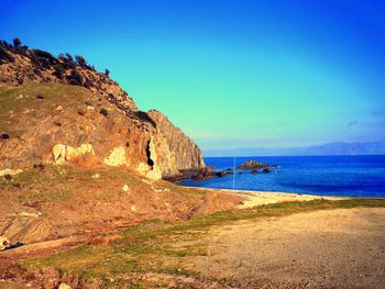 Scenic view of sea against blue sky