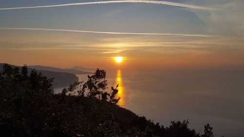 Scenic view of sea against sky during sunset