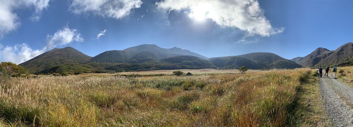 Panoramic view of land and mountains against sky