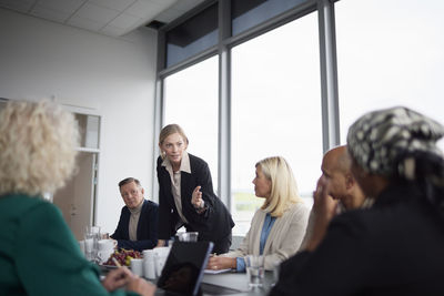 Woman talking during business meeting