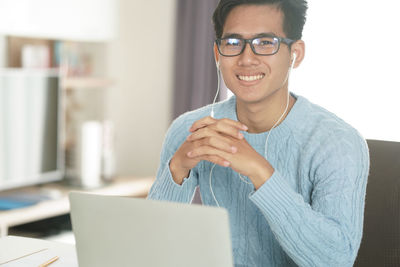 Portrait of young man using mobile phone