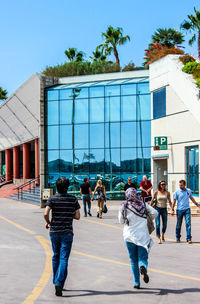 Woman standing in front of building