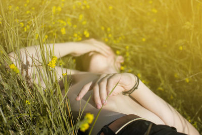 Young boy relaxing on grassy field