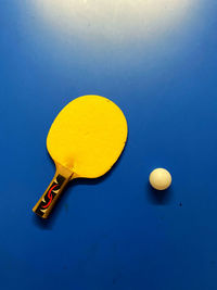 High angle view of lemon on table against blue background