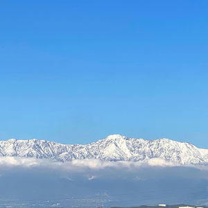 Snowcapped mountains against clear blue sky