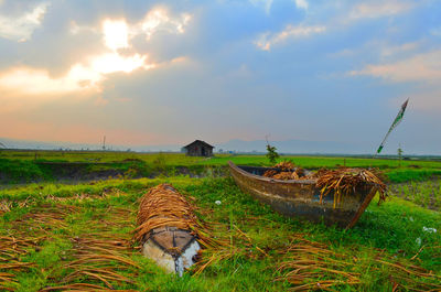 Scenic view of land against sky during sunset