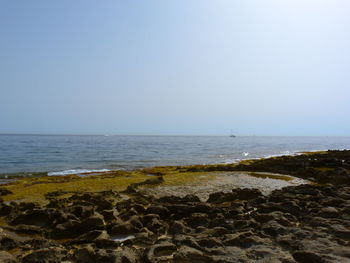 Scenic view of sea against clear sky