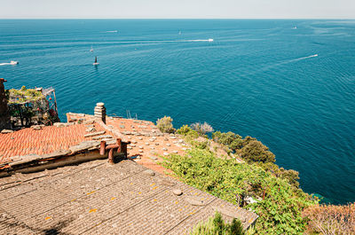 High angle view of building by sea against sky