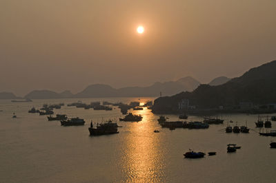 Scenic view of cat ba island against sky at night