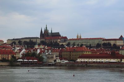 Buildings in city against sky