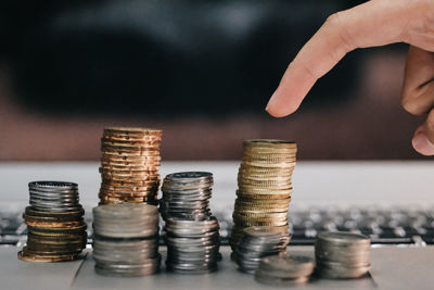 Close-up of hand holding stack of objects