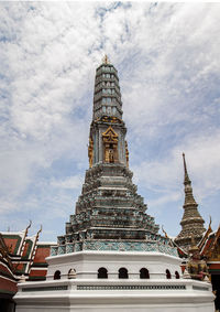 Low angle view of temple building against cloudy sky