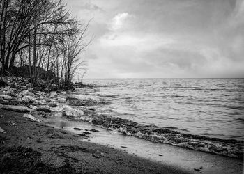 Scenic view of sea against cloudy sky
